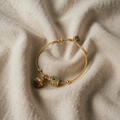Armbånd i antikguld med turkis lotusblomst